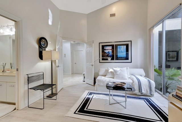 living room featuring high vaulted ceiling