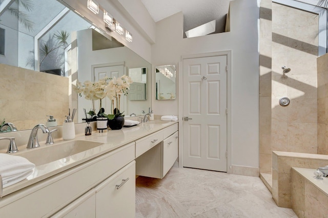 bathroom with double vanity, tile patterned floors, shower with separate bathtub, a textured ceiling, and lofted ceiling