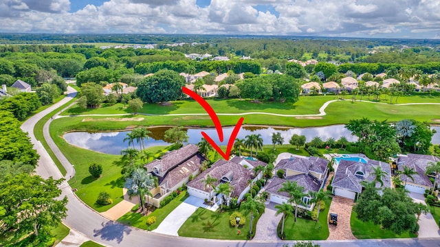 birds eye view of property with a water view