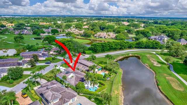 birds eye view of property featuring a water view