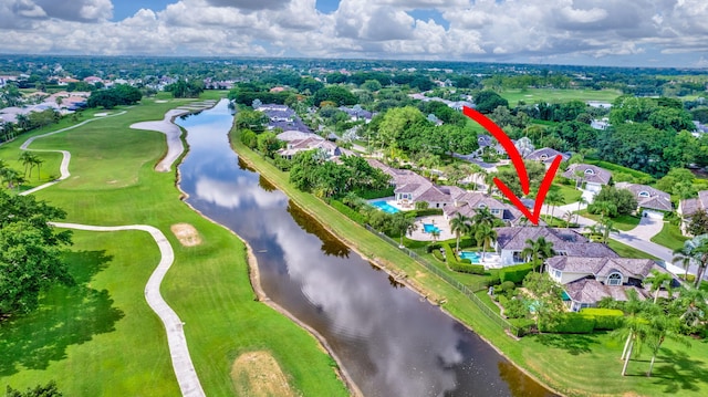 birds eye view of property with a water view