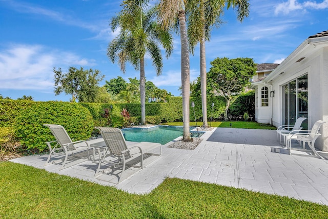 view of swimming pool with a patio