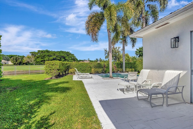 view of yard featuring a patio and a fenced in pool