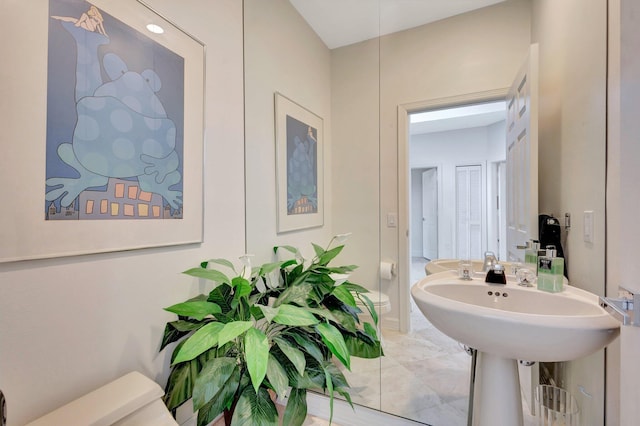 bathroom featuring tile patterned flooring and toilet