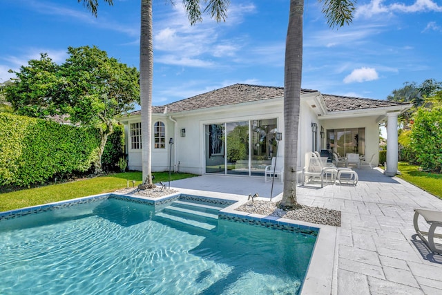 rear view of property with a patio area