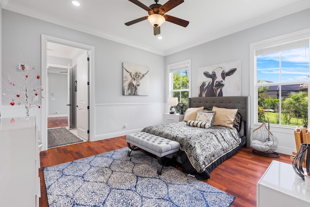 bedroom with ceiling fan, hardwood / wood-style flooring, and ornamental molding