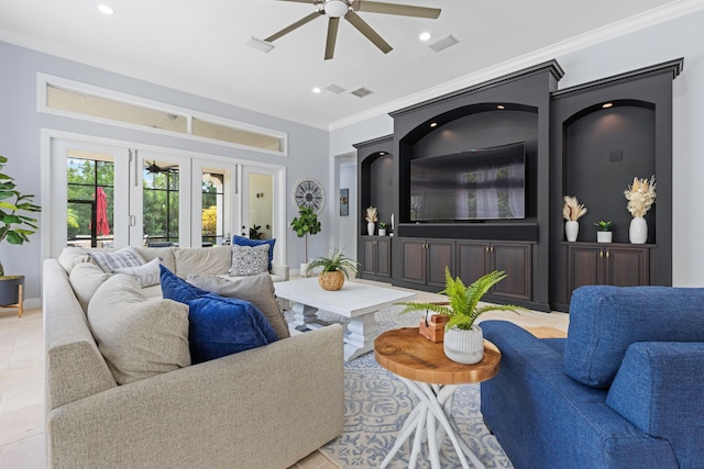 living room with ceiling fan, crown molding, and french doors