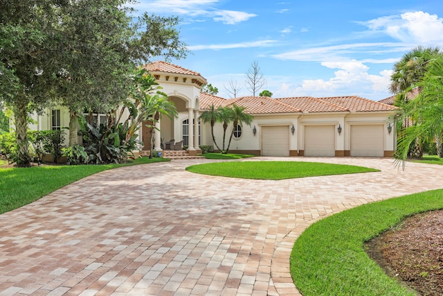 mediterranean / spanish home featuring a garage