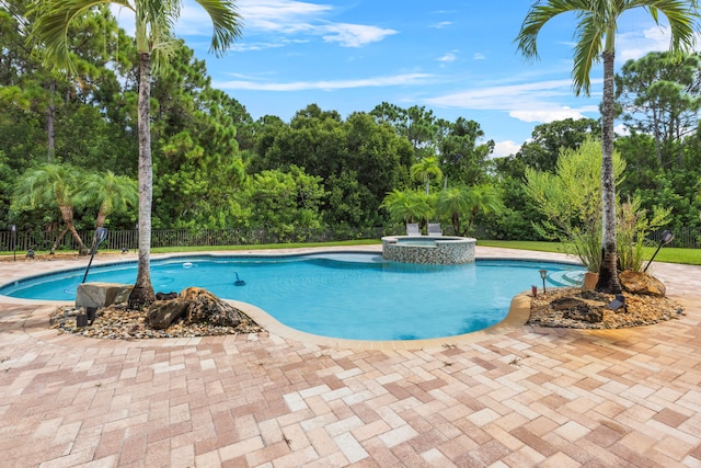 view of pool featuring an in ground hot tub and a patio area