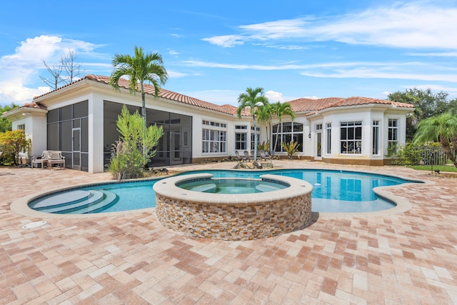 view of pool featuring an in ground hot tub and a patio area