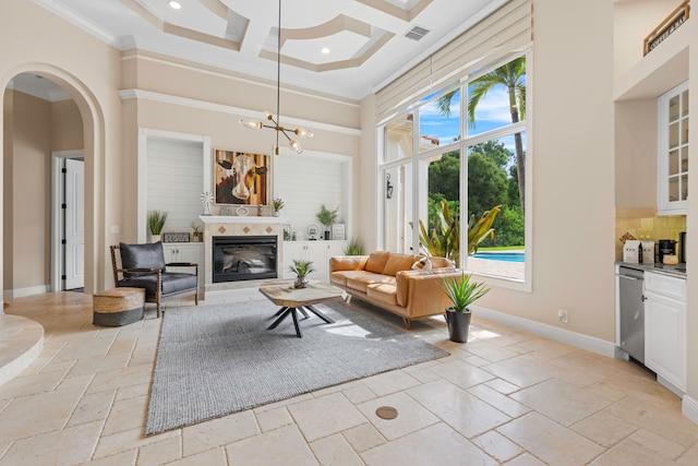 living room with a high ceiling, crown molding, light tile patterned flooring, and coffered ceiling