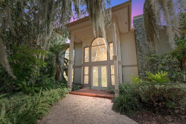 rear view of property featuring french doors