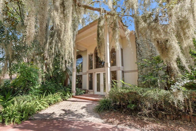 view of side of home with french doors