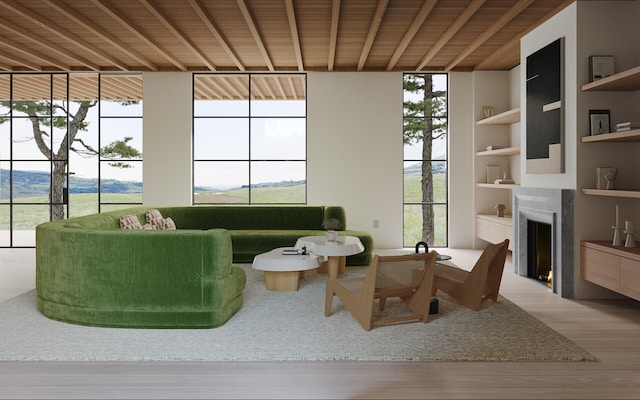 living area with wood ceiling, hardwood / wood-style flooring, and built in shelves