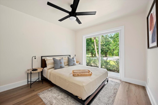 bedroom with wood-type flooring and ceiling fan