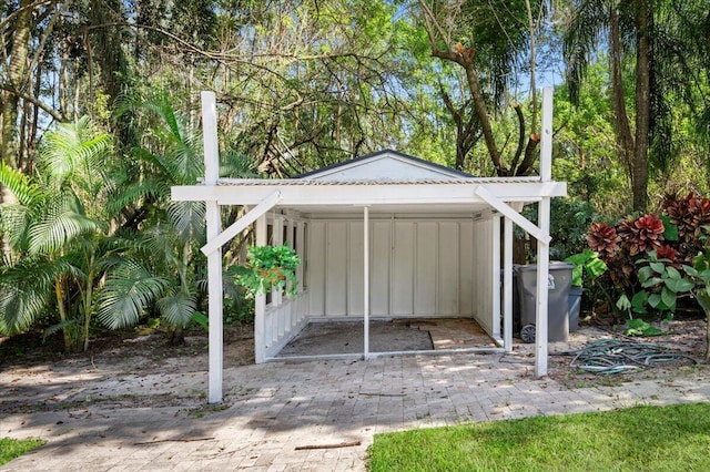 view of outbuilding featuring a carport