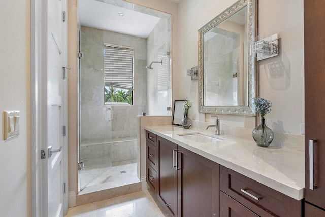 full bath featuring a stall shower and vanity