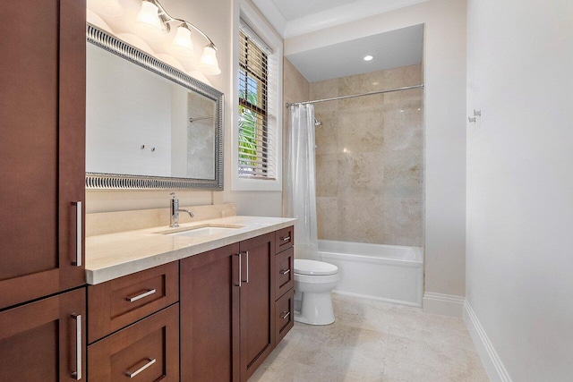 bathroom with baseboards, vanity, toilet, and shower / bath combination with curtain