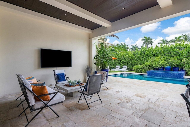 view of patio / terrace featuring a pool with connected hot tub