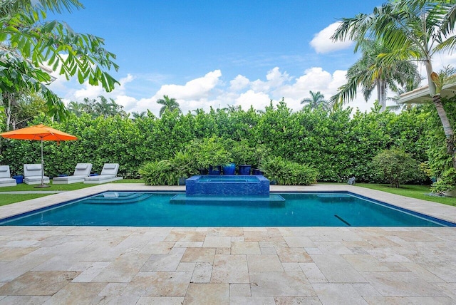 view of pool featuring a pool with connected hot tub and a patio