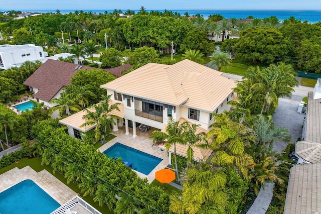 birds eye view of property with a water view