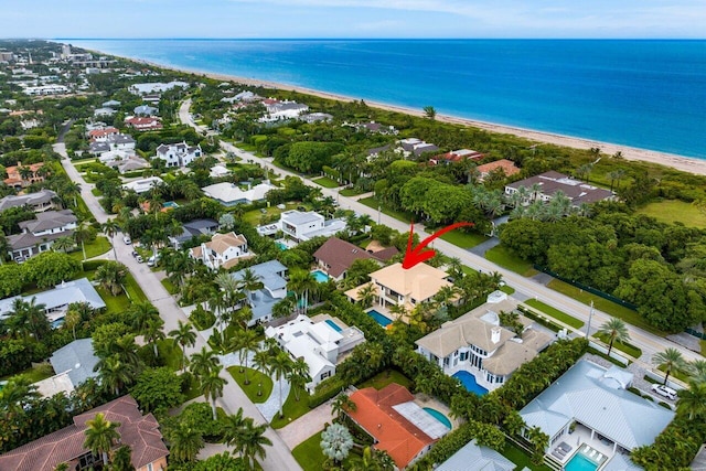 aerial view with a beach view, a residential view, and a water view