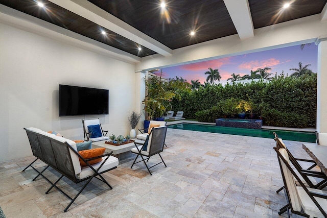 view of patio / terrace with outdoor lounge area and a pool with connected hot tub