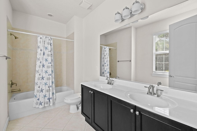 full bathroom with vanity, shower / bath combo, toilet, and tile patterned floors