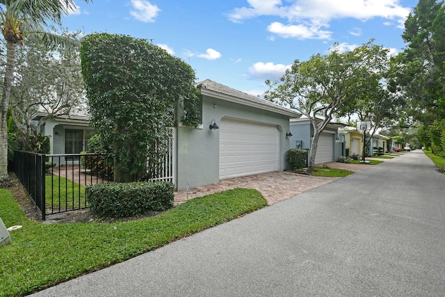 view of side of property with a garage