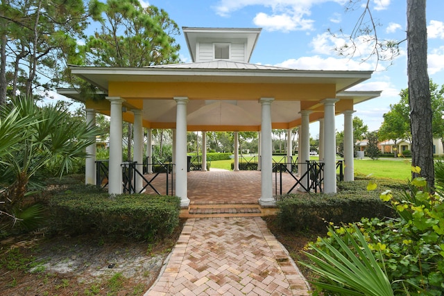 view of community featuring a gazebo and a lawn