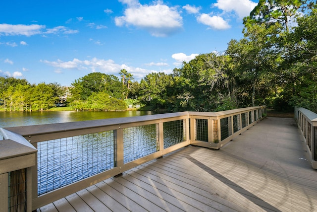 dock area with a deck with water view