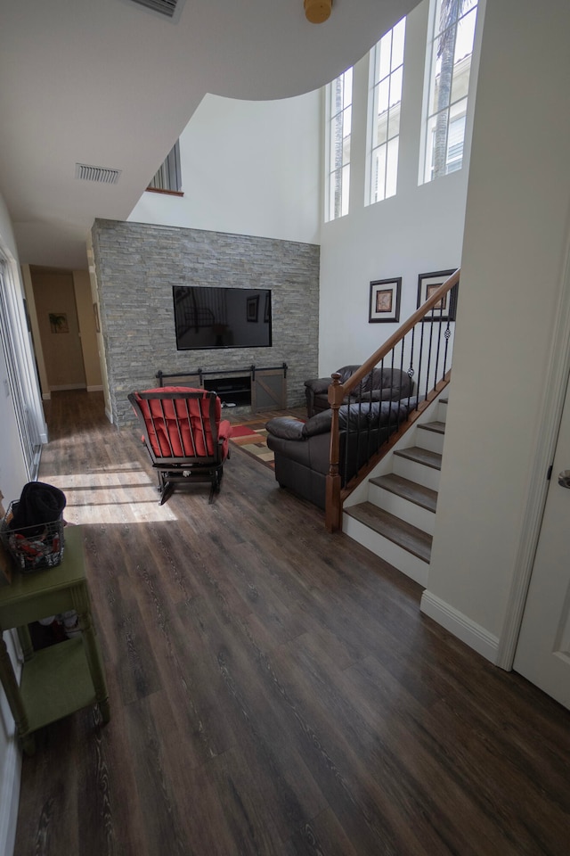 living room featuring a fireplace and hardwood / wood-style floors