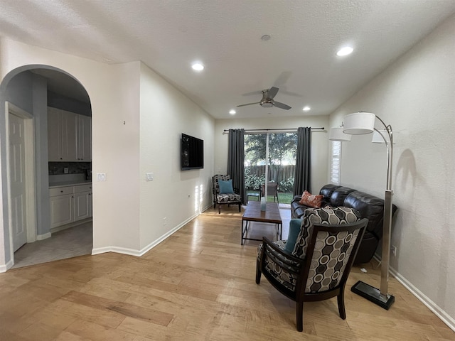 328 SE Bloxham Way, Stuart, FL 34997 - living area with a ceiling fan, light wood-type flooring, baseboards, and recessed lighting