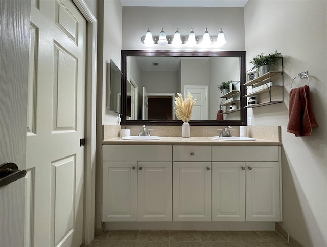 328 SE Bloxham Way, Stuart, FL 34997 - bathroom featuring double vanity and tile patterned floors