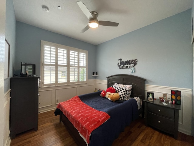 328 SE Bloxham Way, Stuart, FL 34997 - bedroom with wainscoting, wood finished floors, and ceiling fan