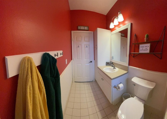 328 SE Bloxham Way, Stuart, FL 34997 - bathroom with vanity, tile patterned floors, toilet, and lofted ceiling