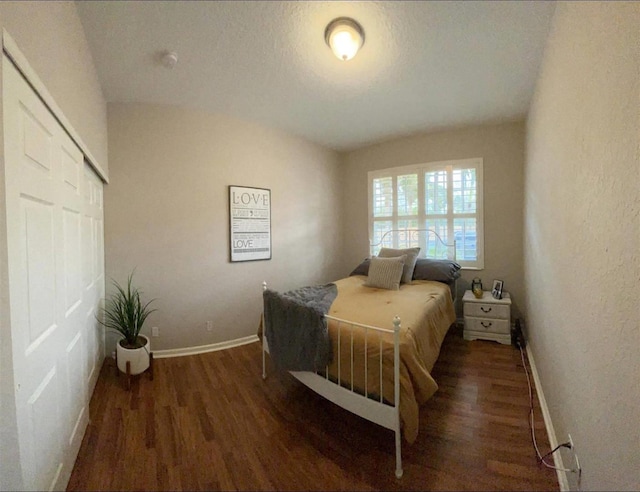328 SE Bloxham Way, Stuart, FL 34997 - bedroom featuring wood finished floors, baseboards, and a closet
