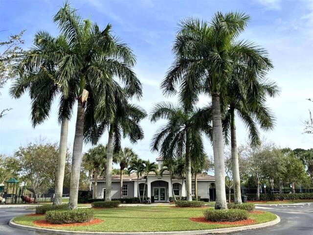328 SE Bloxham Way, Stuart, FL 34997 - view of property's community featuring a lawn