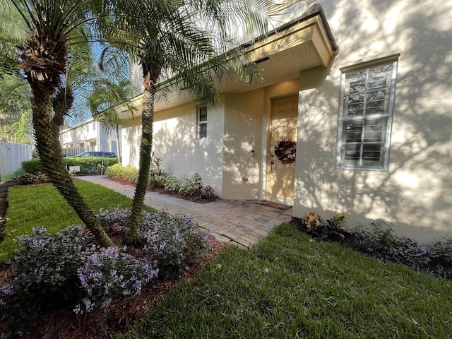 328 SE Bloxham Way, Stuart, FL 34997 - view of exterior entry with stucco siding