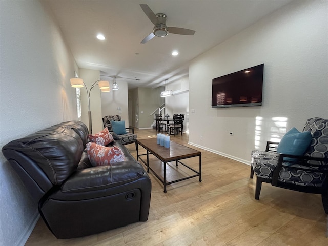328 SE Bloxham Way, Stuart, FL 34997 - living area featuring light wood finished floors, a ceiling fan, baseboards, and recessed lighting