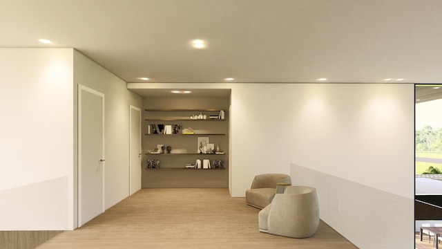 corridor with wood finished floors and recessed lighting