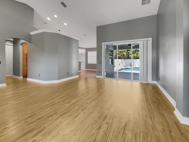 unfurnished living room with ceiling fan and light hardwood / wood-style floors