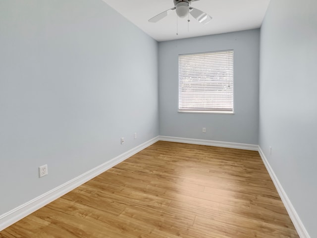 spare room featuring light wood-type flooring and ceiling fan