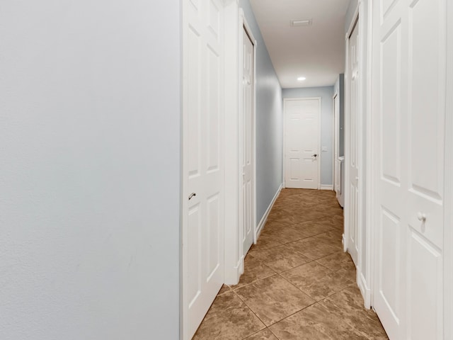 hallway with light tile patterned floors