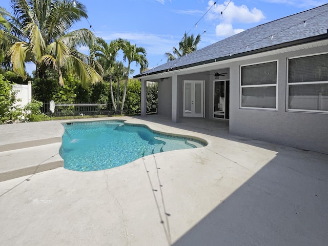 view of pool featuring a patio, ceiling fan, and pool water feature