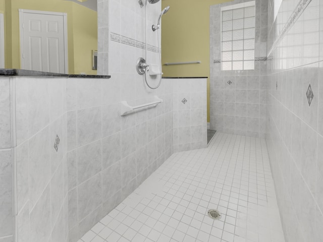 bathroom with a tile shower