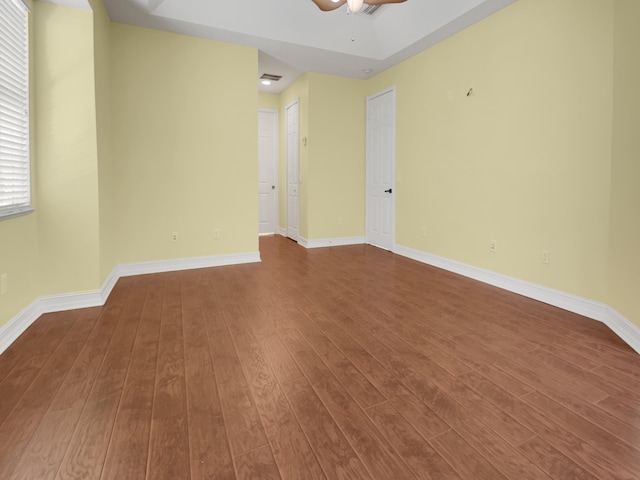 unfurnished room with hardwood / wood-style flooring and ceiling fan