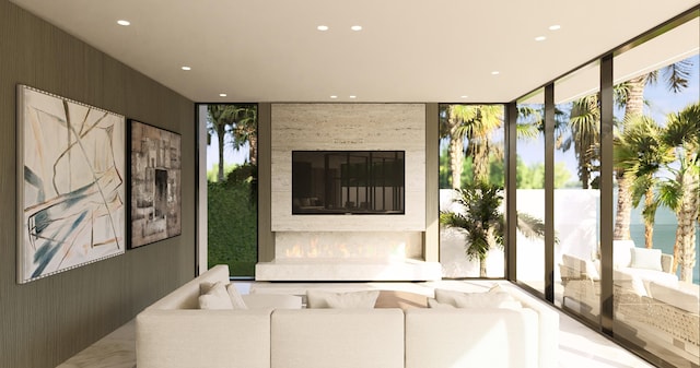 living area with floor to ceiling windows and recessed lighting