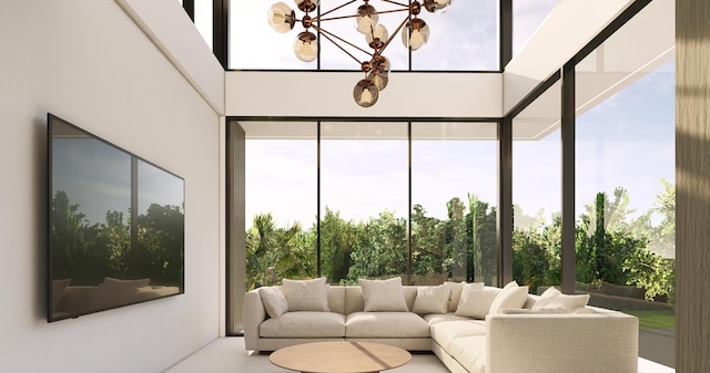 sunroom / solarium with a healthy amount of sunlight and an inviting chandelier