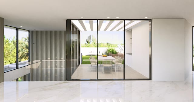 doorway to outside with recessed lighting and floor to ceiling windows